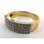 A 9ct yellow gold ring set four rows of small diamonds, total diamond weight approximately 0.