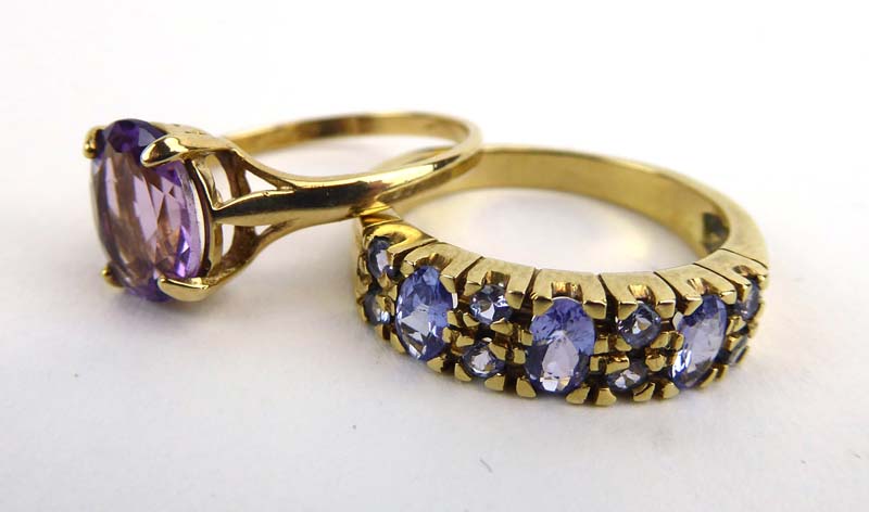 A 9ct yellow gold ring set amethyst in a four claw setting,