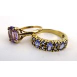 A 9ct yellow gold ring set amethyst in a four claw setting,