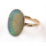 An early 20th century yellow metal ring set oval opal, ring size P, 2.