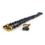 A single strand continuous cultured Tahitian peal necklace with gold plated clasp, pearl d. 7 mm, l.