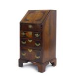 An 18th century and later walnut, crossbanded and strung bureau,