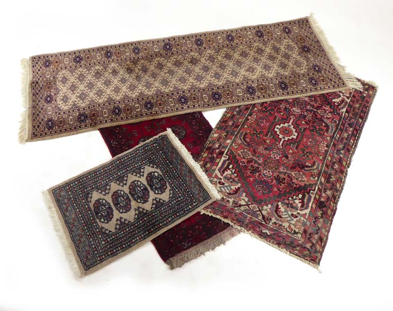 A group of six late 19th century and 20th century rugs including three with Heriz-type patterns and
