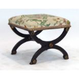 An ebonised and gilt highlighted stool with an upholstered seat