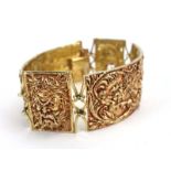 A 1970's Sante Privitera yellow metal four section bracelet relief decorated in the Renaissance