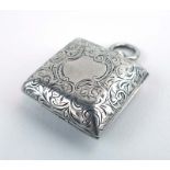 An Edwardian silver florally engraved sovereign case of square form, Birmingham 1903, l.