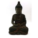 A Tibetan painted and carved wood figure modelled as the Buddha in meditation, h. 37.