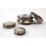 Five silver dressing table bottle lids, various dates and makers, max d.
