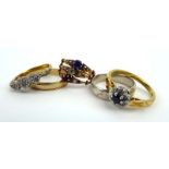 An 18ct yellow gold ring set three small diamonds in heart shaped settings,