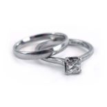 A platinum ring set princess cut diamond in a four claw setting, stone approximately 0.