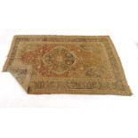 An early 20th century rug, the red ground with a hunting scene,