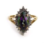 A 9ct yellow gold ring set marquise shaped mystic topaz within a border of small diamonds,