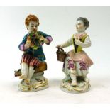 A pair of late 19th/early 20th century porcelain figures modelled as a dandy and his female