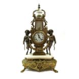 A 20th century mantle clock, the German movement striking on a bell,