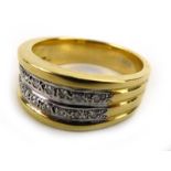 A gentleman's 18ct yellow gold ring set two rows of small diamonds within a reeded band,