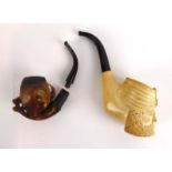 A meerschaum-type figural pipe together with a pipe modelled as a scaled claw CONDITION