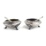 A pair of Victorian silver and parcel gilt salts of circular form,
