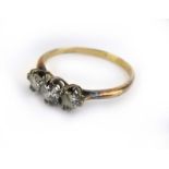 An 18ct yellow gold ring set three graduated diamonds, ring size P,