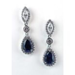A pair of 9ct white gold ear pendants of teardrop design set clear and blue paste, overall 4.