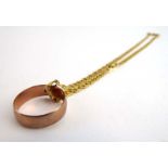 An 18ct yellow gold fancy link necklace, 10.1 gms, together with a 9ct yellow gold wedding band, 2.