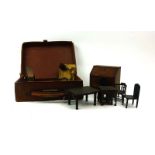 A leather case containing a suite of Pit-a-Pat series miniature/doll's house furniture