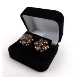 A pair of yellow and white metal ear studs of flowerhead design set diamonds and rubies,