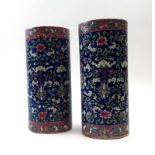 A pair of early 20th century Chinese brush pots of cylindrical form decorated with stylised