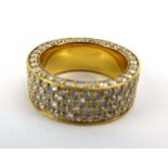 A yellow metal full eternity ring set four rows of small brilliant cut diamonds,