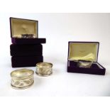 A set of eight silver napkin rings, engraved with a garland of leaves, maker HG&S, Sheffield 1978,