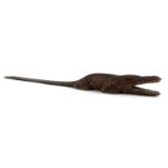 A faux crocodile skin figural letter opener