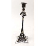 A WMF cast metal candlestick of elongated form in the Art Nouveau manner, h. 27.