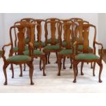 A set of twelve Queen Anne-style walnut dining chairs,