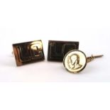 A pair of yellow metal cufflink's of rectangular form decorated with the initials 'LC',