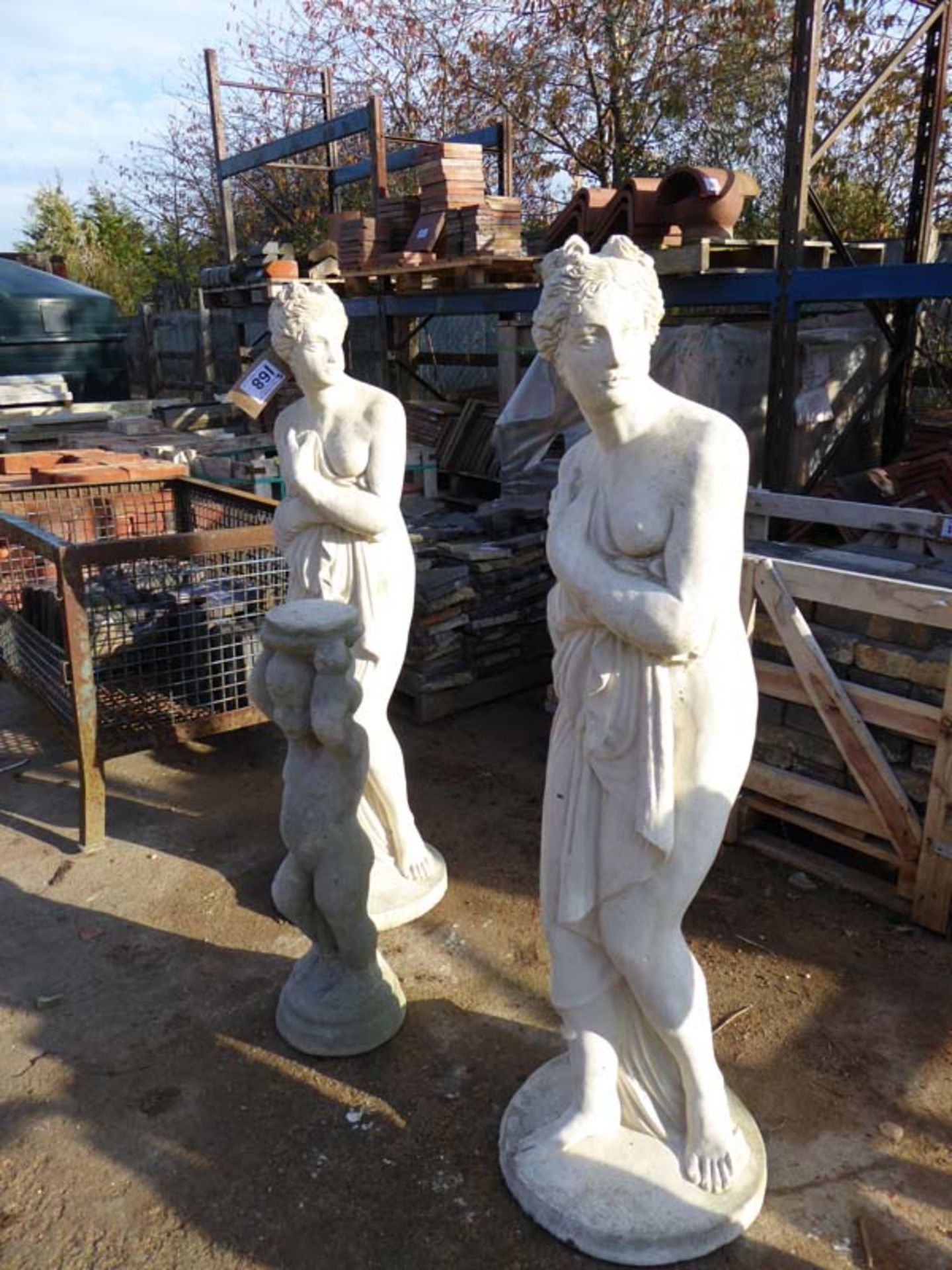 Pair of 1m high concrete ornaments 'ladies' and 1 other