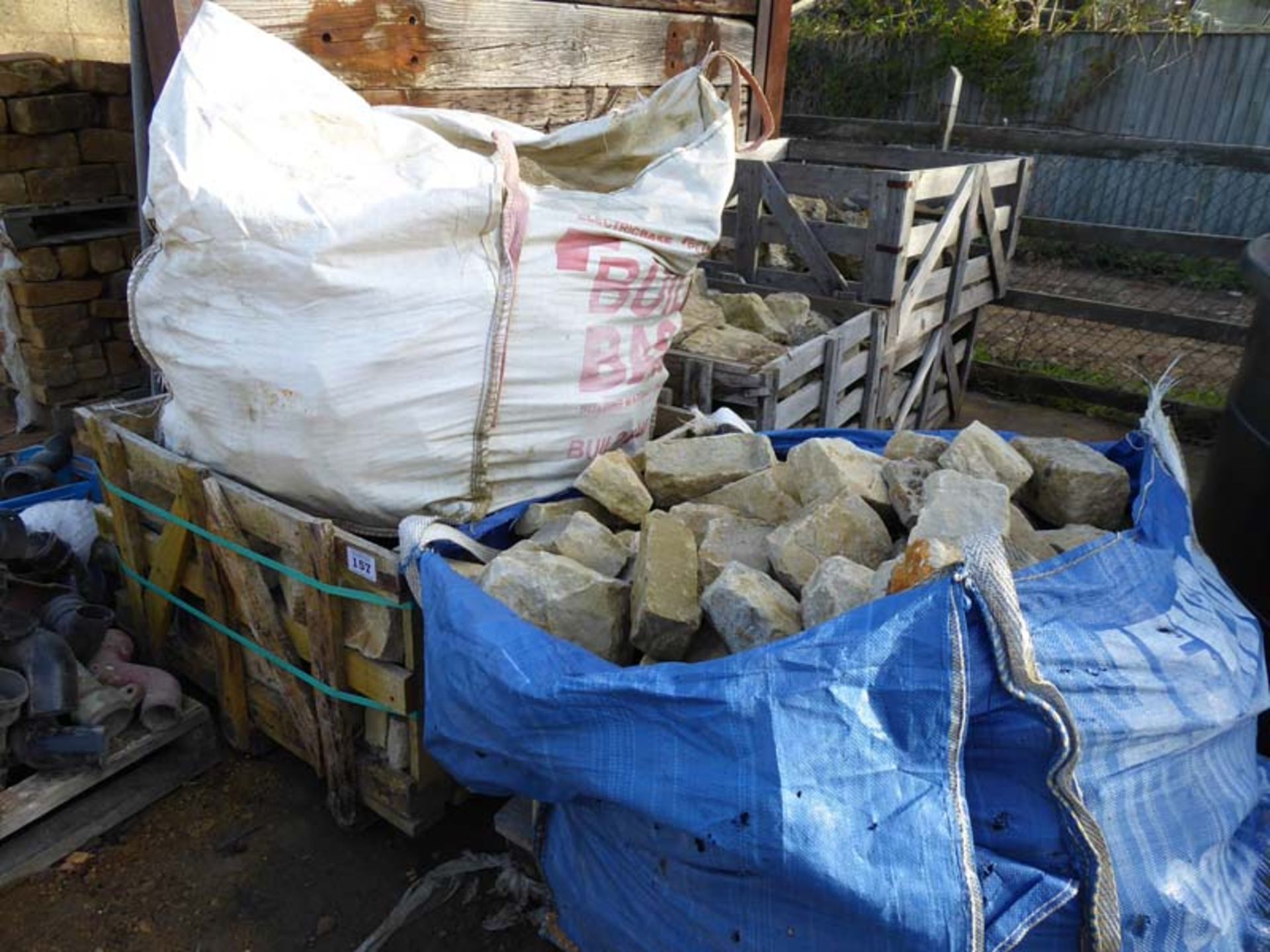 4 stillages and 2 builders bags of York walling stone