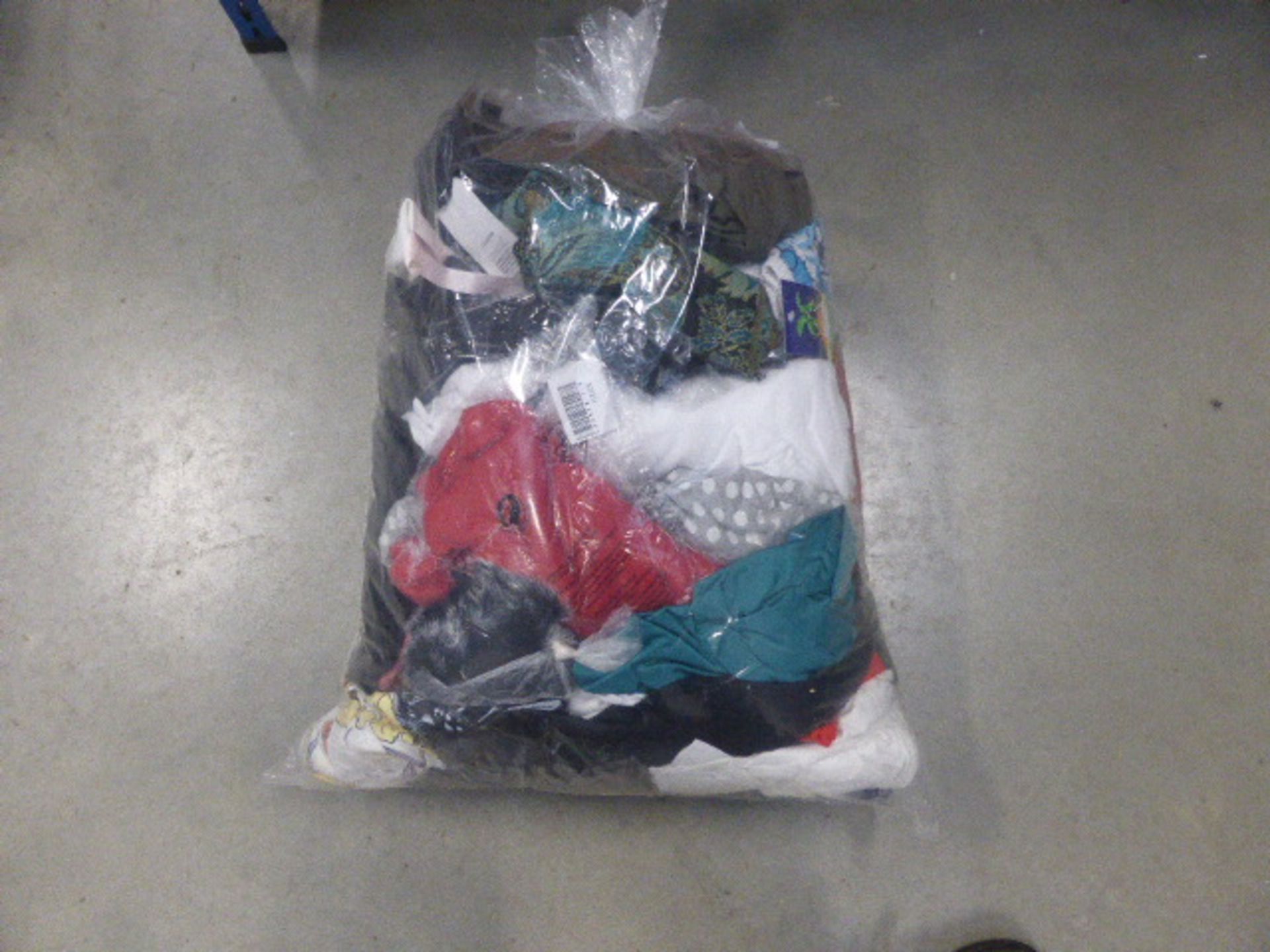 Bag containing selection of mixed clothing