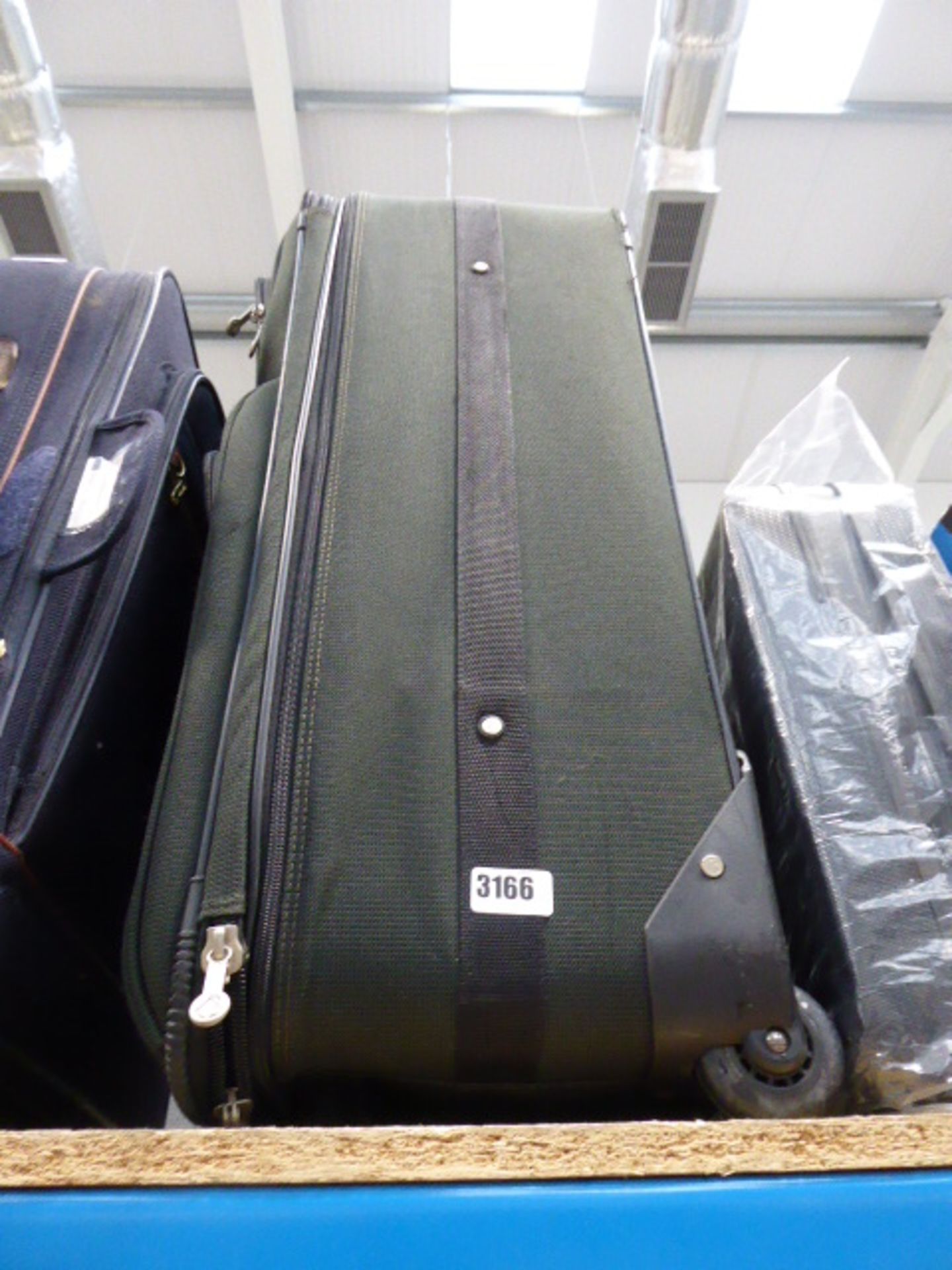 Large green suitcase