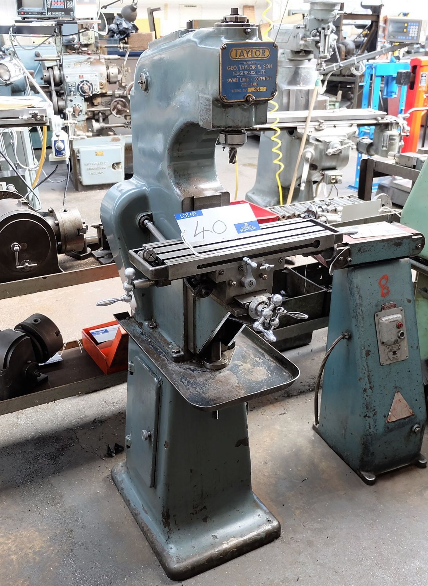 A Geo. Taylor Vertical Milling Machine No.901 with tooling, 17.5in x 5.75in table.