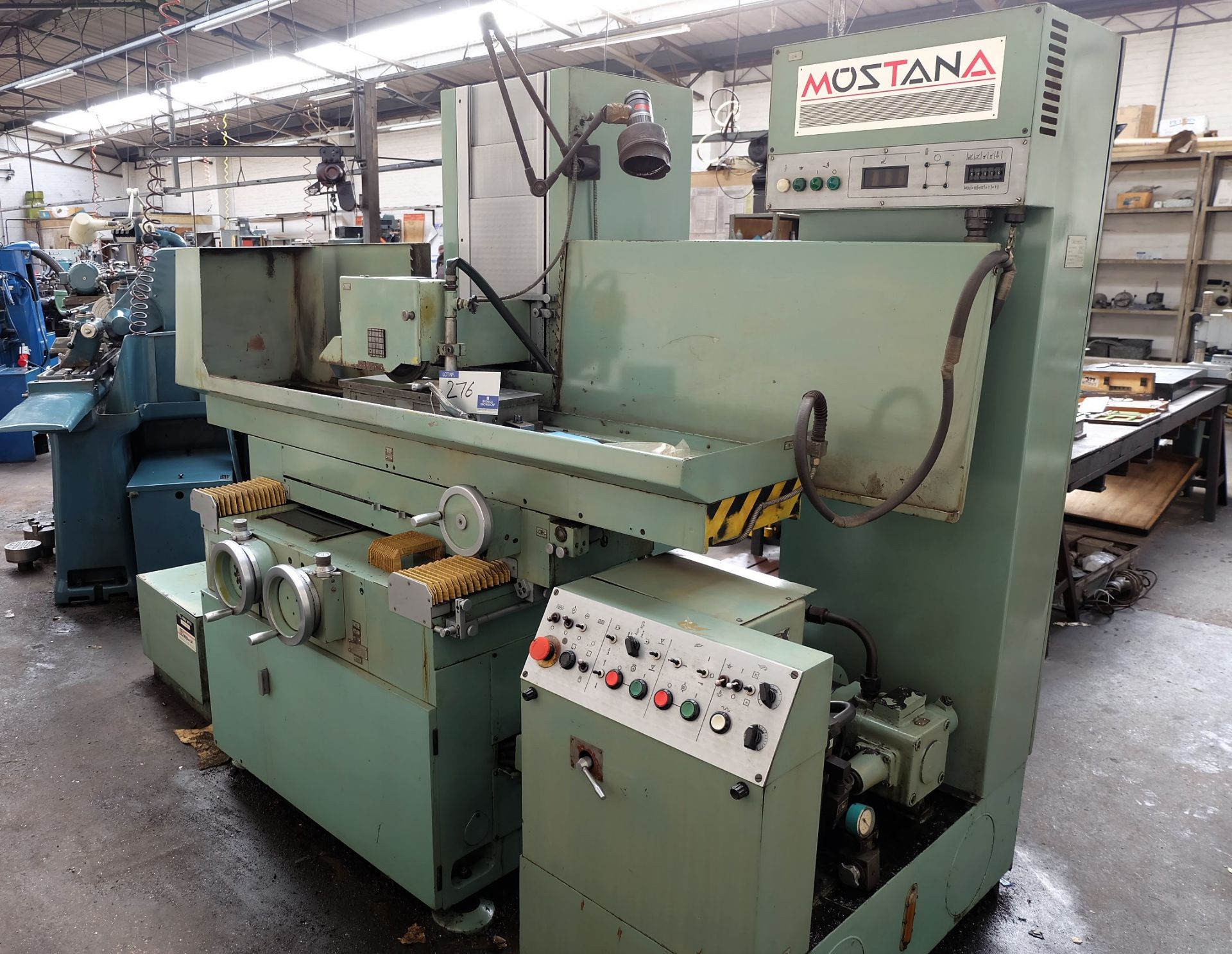 A Mostana Automatic Horizontal Surface Grinding Machine: 24in x 8in with coolant.