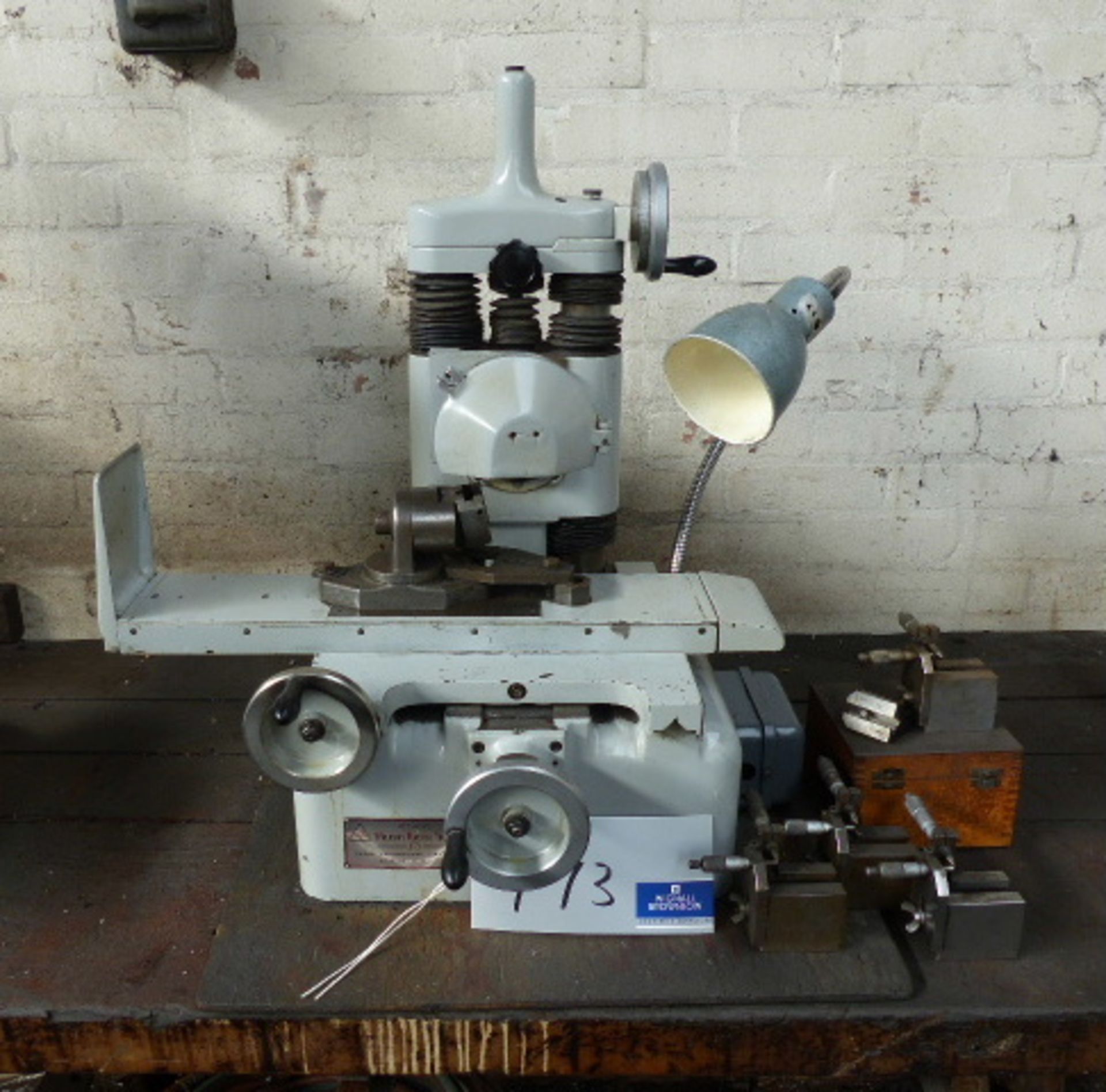 A Bench Type Surface Grinder, 7.5in x 4in table with machine light.