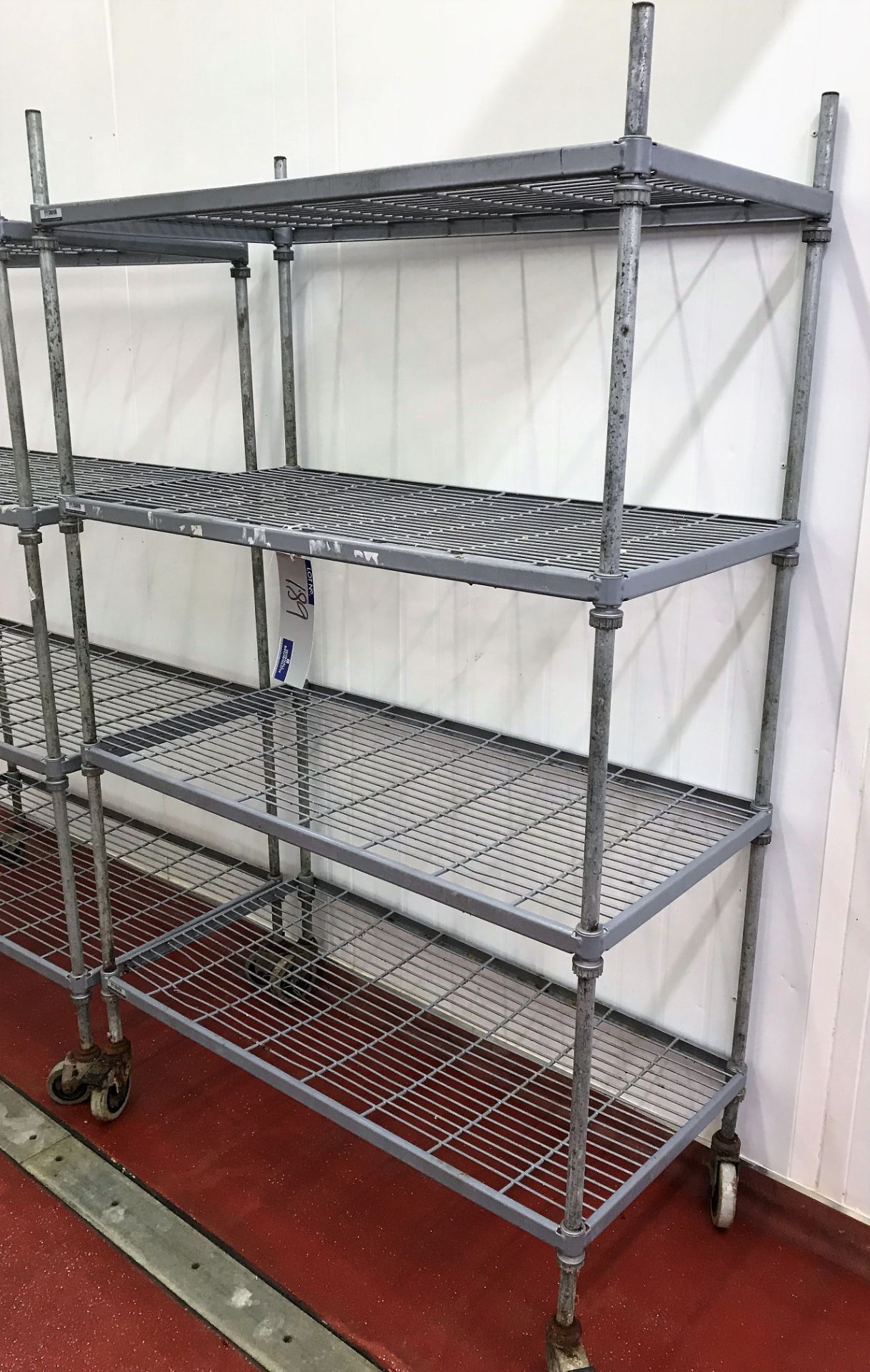 A Craven Mobile 4 tier Plastic Coated Wire Rack, 4