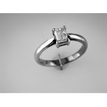 An Emerald Cut Diamond Ring