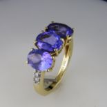 An Oval Tanzanite Trilogy and Diamond Ring