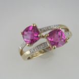 A Pink Topaz and Diamond Crossover Ring