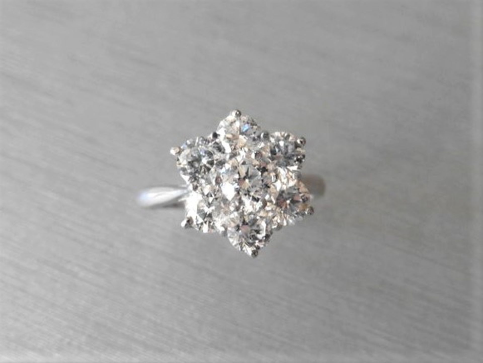 2.25ct diamond cluster style dress ring. 7 Brilliant cut diamonds, I colour and si2-3 clarity.