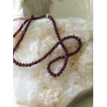 30 cts Purple Garnets plain rounds beads on long 38 cm strand
