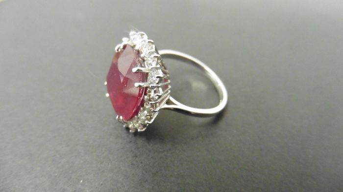 9ct ruby and diamond cluster ring. Oval cut ruby( glass filled) in the centre surrounded by - Image 2 of 4