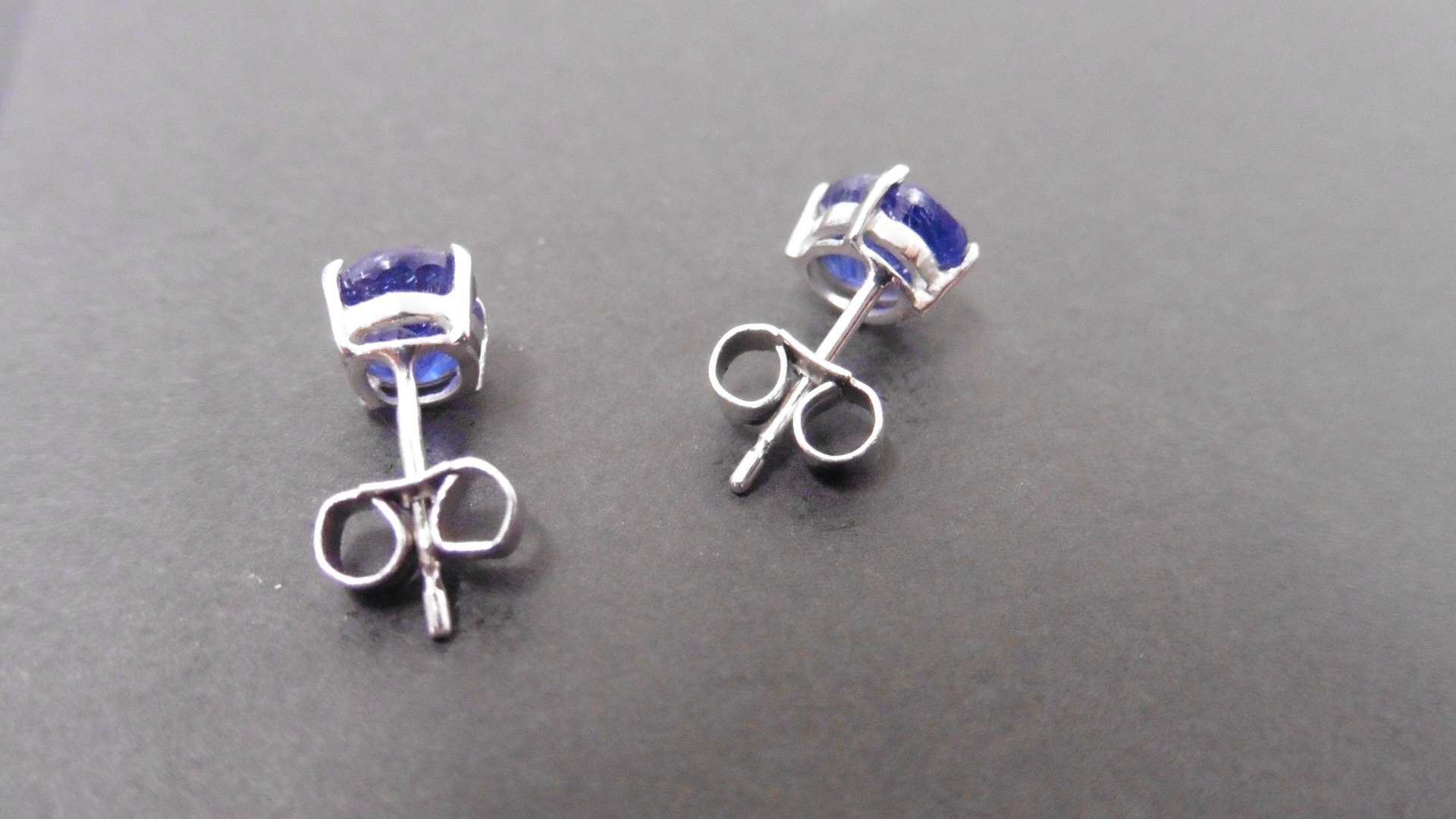 1.60ct Sapphire stud style earrings set in 9ct white gold. 7 x 5mm oval cut sapphires( glass - Image 2 of 2