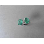 1.60ct emerald stud style earrings set in 9ct white gold. 7 x 5mm oval cut emeralds ( treated) set