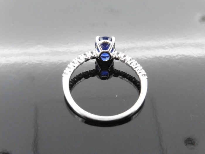 0.80ct / 0.12ct sapphire and diamond dress ring. Oval cut ( treated ) sapphire with small diamonds - Image 2 of 3